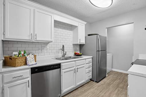 Updated apartment kitchen with ample cabinet space at Southwinds Point Apartments near Atlanta.