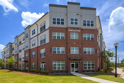 Exterior view of Springview Apartments in Decatur, GA featuring modern pet-friendly 1, 2 and 3 bedroom apartment homes near Panthersville Road.