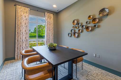Community business center with private workspaces and modern seating at Springview Apartments near Panthersville Road.