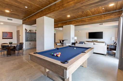 Modern resident lounge with billiards, seating areas and entertainment space at Springview Apartments Decatur GA.