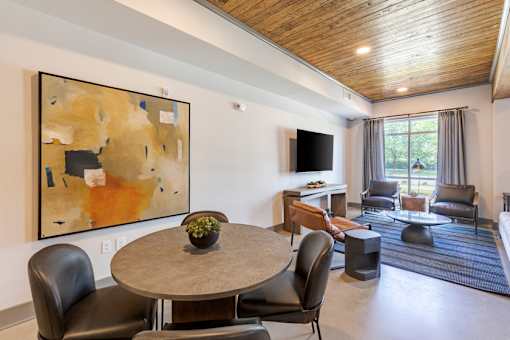 Open resident clubhouse with lounge seating and community gathering spaces at Springview Apartments in Decatur, GA.