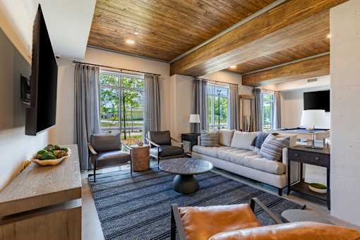 Stylish clubhouse lounge with television, seating and gathering areas at Springview Apartments near South DeKalb.