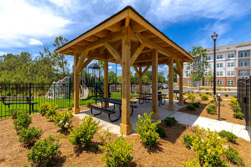 Community pavilion with landscaped green space at Springview Apartments located near Panthersville in Decatur, Georgia.