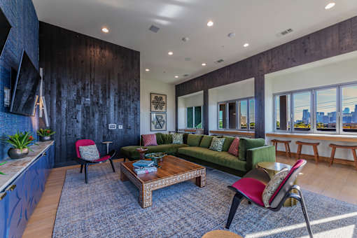 a living room filled with furniture and a large window