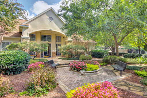 A house with a garden in front.