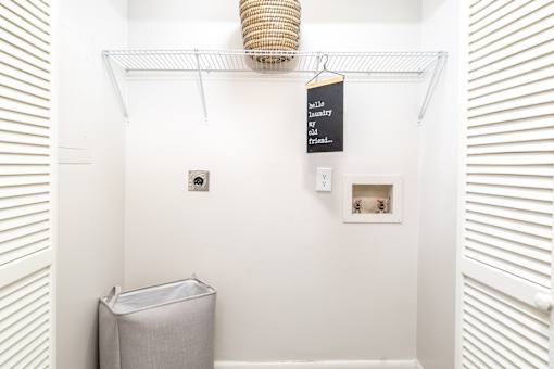 Laundry closet with washer dryer connections at Sugar Creek Apartments in Winston Salem NC