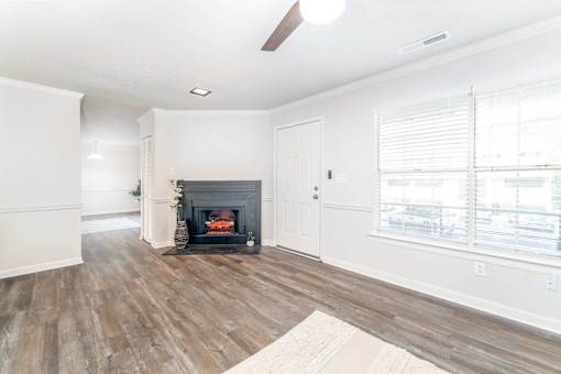 Spacious unfurnished apartment living room with fireplace at Sugar Creek Apartments in Winston Salem NC