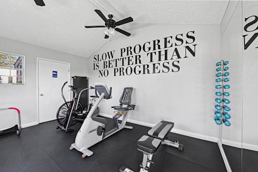 Fitness center with equipment for light exercise at Sunnyside Senior Apartments in San Dimas, California