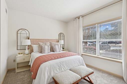 Spacious bedroom with natural light and neutral decor in Tattersall Village Apartments, Hinesville, GA