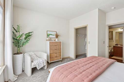Well-lit bedroom with soft tones and ample closet space at Tattersall Village Apartments, Hinesville, Georgia