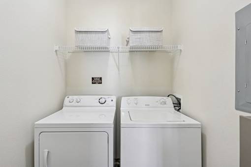 In-unit washer and dryer in a dedicated laundry space at Tattersall Village Apartments in Hinesville
