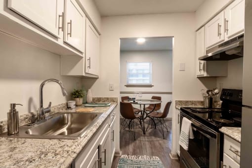 The Jaunt Apartments in Charleston South Carolina photo of kitchen with white cabinets