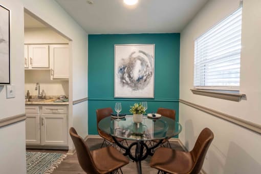 The Jaunt Apartments in Charleston South Carolina photo of a dining room area with table and painting