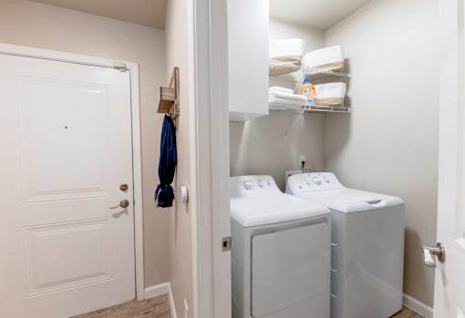 In-unit washer and dryer set in a modern laundry area at The Sanctuary at 331 in Santa Rosa Beach, FL