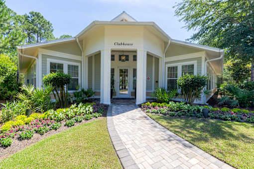 A white building with a sign that says Clubhouse.