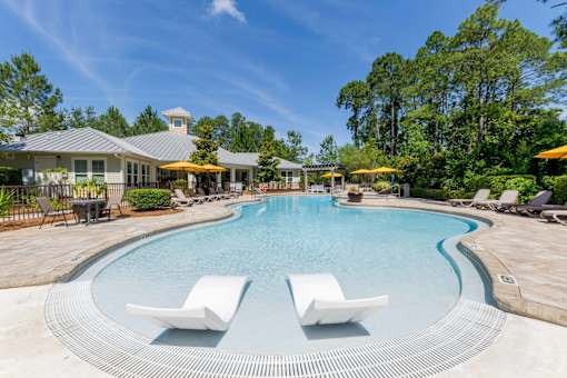 Resort-style swimming pool with lounge seatin at The Sanctuary at 331 in Santa Rosa Beach, FL