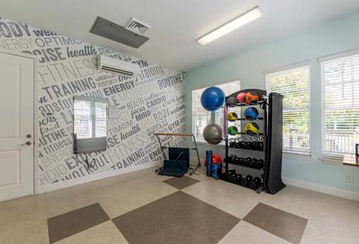 Bright fitness center with cardio machines and strength-training equipment at The Sanctuary at 331 in Santa Rosa Beach, FL