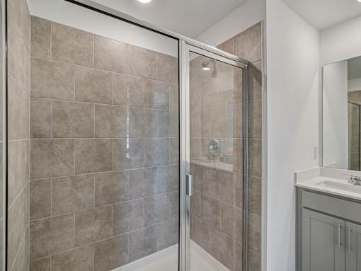 Spacious bathroom with tiled shower at The Maple 3-bedroom townhomes in Raleigh NC