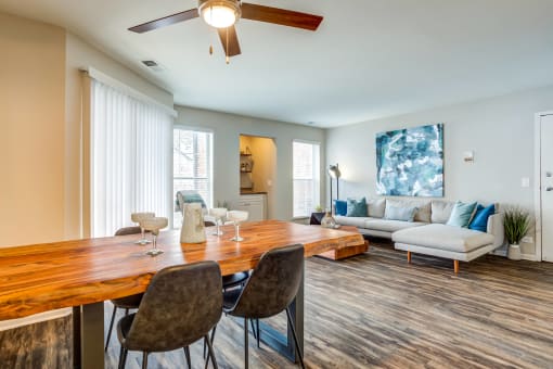 Apartments in Glendale Heights for rent - The Mark - living room with a dining room table and a couch