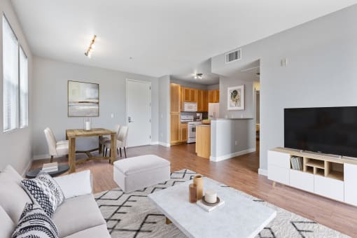 a living room with a couch and a table and a television