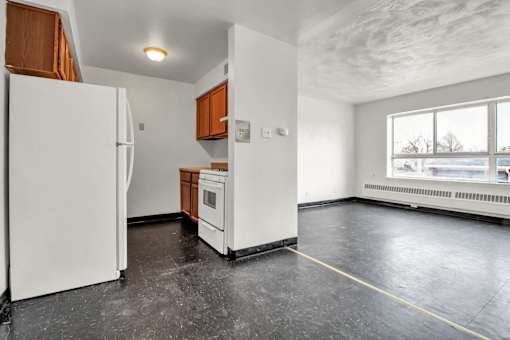 A kitchen with a white refrigerator and a white oven.