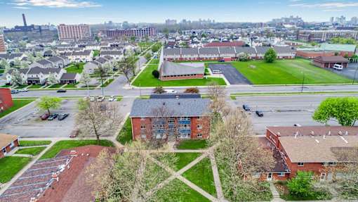 A view of a campus with a large building in the center.