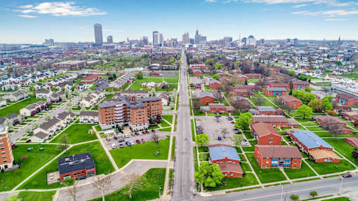 A cityscape with a mix of residential and commercial buildings.