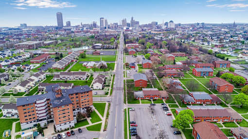 A cityscape with a mix of residential and commercial buildings.