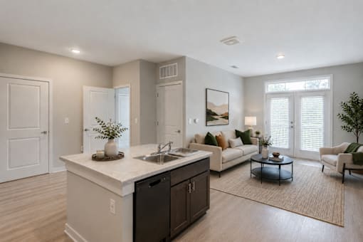 Professionally staged open-concept living room at Townes at Clarkston Centre, a pet-friendly apartment community in Clarkston, GA near Decatur.