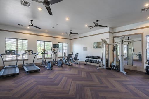 the preserve at ballantyne commons fitness room with cardio equipment and windows