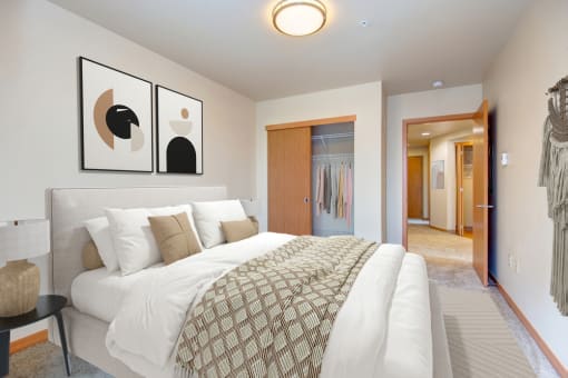 a bedroom with a large bed and a closet