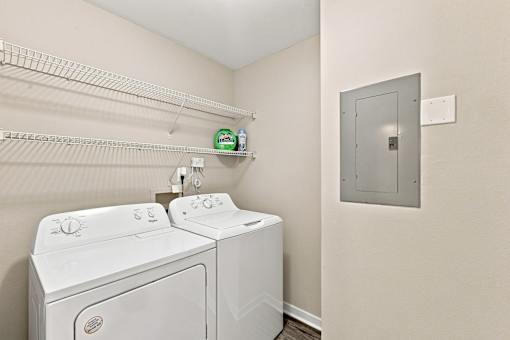 Full-size washer and dryer in a Twin Oaks apartment home in Hattiesburg, MS 39402