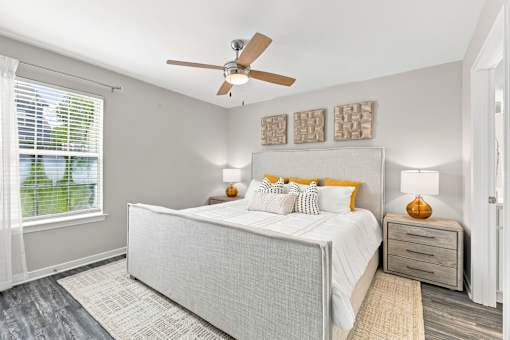 Bright primary bedroom at Twin Oaks Apartment Homes near Oak Grove in Hattiesburg