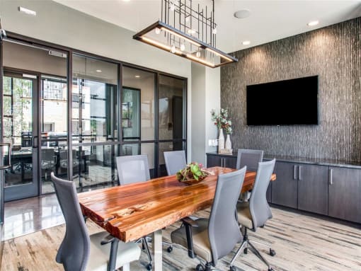 a conference room with a wooden table and chairs