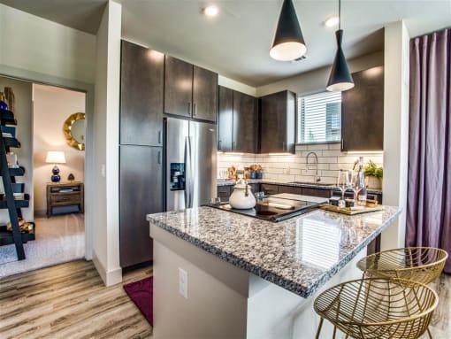 Grand Prairie Apartments for Rent - Kitchen With Stainless Steel Appliances, Sleek Cabinetry and Modern Finishes