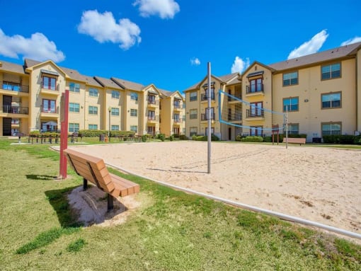 Exterior photo of Oak hollow with benches and beach volleyball