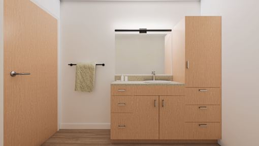 A bathroom with a sink, mirror, and wooden cabinets.