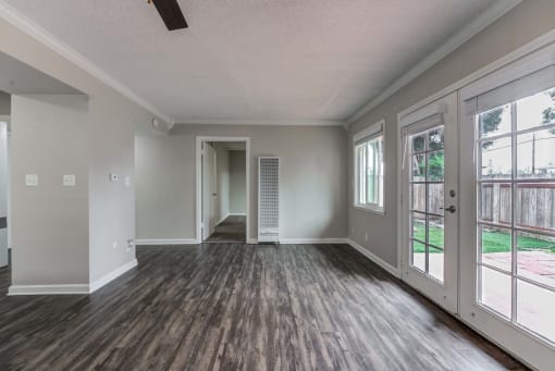 an empty living room with a patio door