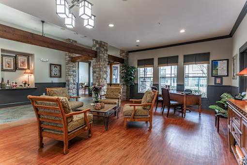 A living room with wooden floors and furniture.