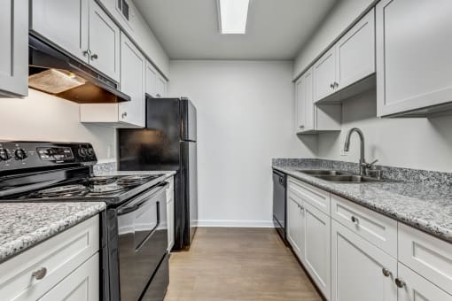 Whitney Manor Apartments in Gretna, LA photo of  kitchen with hardwood floors