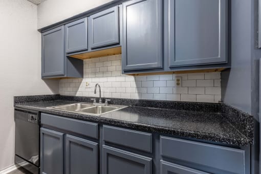Whitney Manor Apartments in Gretna, LA photo of kitchen with subway tile backsplash
