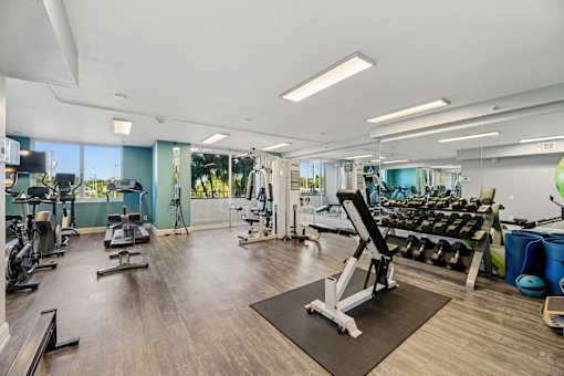 Fitness center with cardio and strength equipment at Wilton Tower apartments in Wilton Manors, FL.