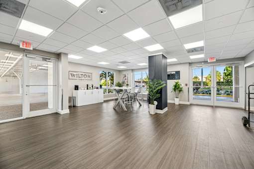 Resident clubhouse with seating and workspaces at Wilton Tower apartments in Wilton Manors, FL.