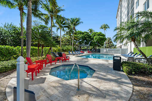 Outdoor hot tub and seating area at Wilton Tower pet-friendly apartments in Wilton Manors, FL.