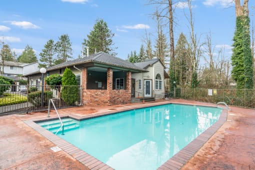 1 BR Apartments in Everett Washington - Woodbrook - Pool with Stained Concrete Deck and Trees