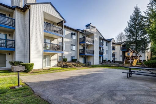 2 BR Apartments in Everett Washington - Woodbrook - BBQ Area with Grill, Picnic Table, and Playground