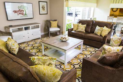clubhouse with seating at Woodlake Villas pet-friendly apartments in Orlando, FL