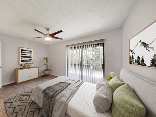 a bedroom with a bed and a ceiling fan