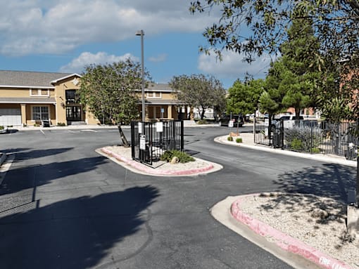 A black gate stands in front of a building.