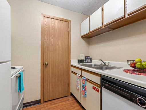 a kitchen with a sink and a dishwasher